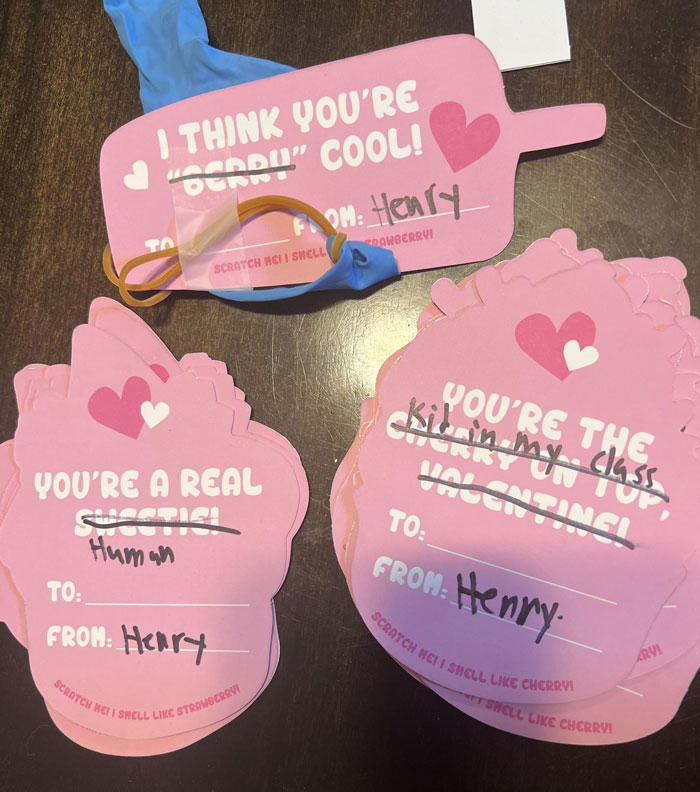 Hilarious kids' Valentine's cards with funny edits from Henry, featuring hearts and pink designs.