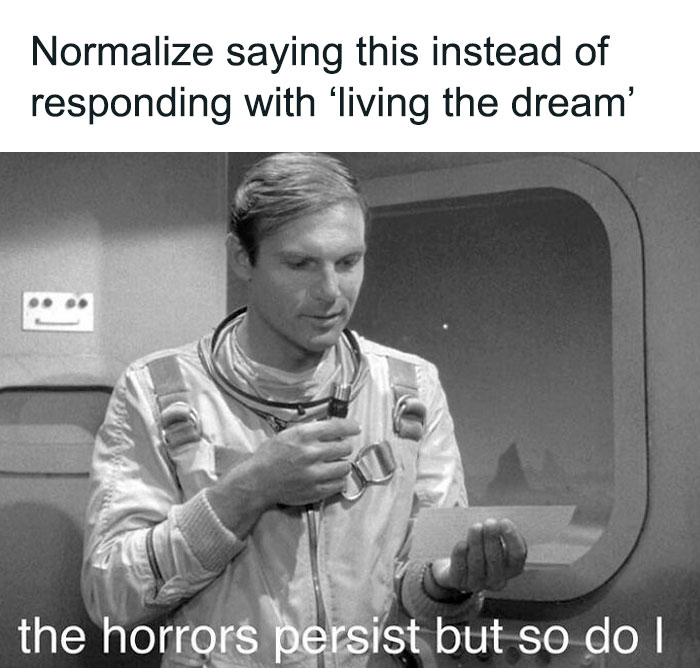 A man in a retro spacesuit, reading a note with meme text on screen.