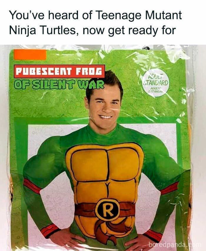 Man wearing a humorous "Pubescent Frog" costume resembling a superhero, parodying Teenage Mutant Ninja Turtles.