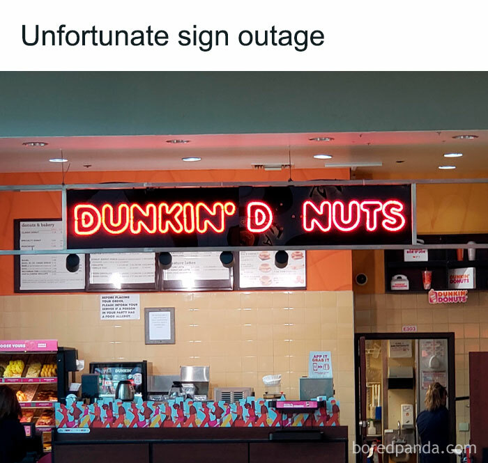 Sign reads "DUNKIN' D NUTS" due to light outage, creating a hilarious random meme moment.