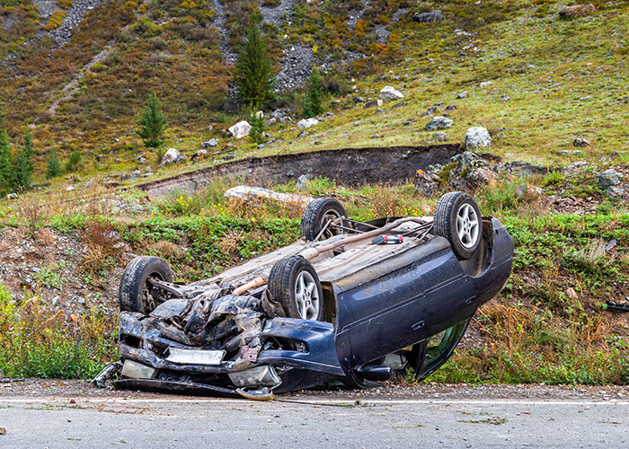 Overturned car on a rural road highlights how normal things can become horrific in an instant.