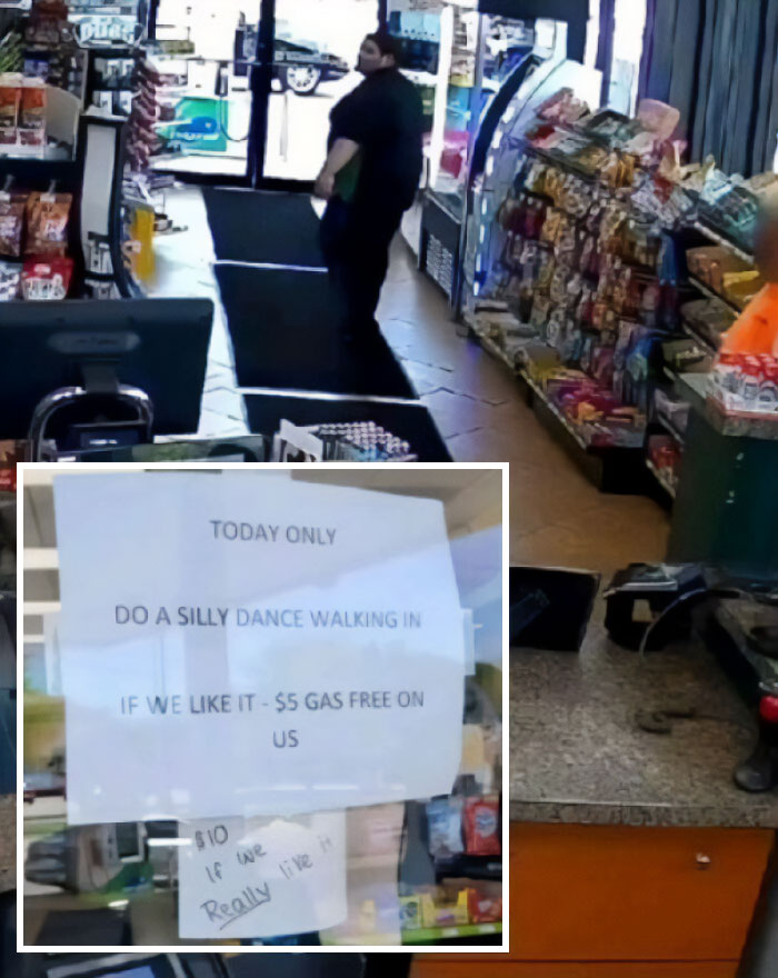 A person exits a convenience store with a humorous gas discount sign promoting capitalism spirit.