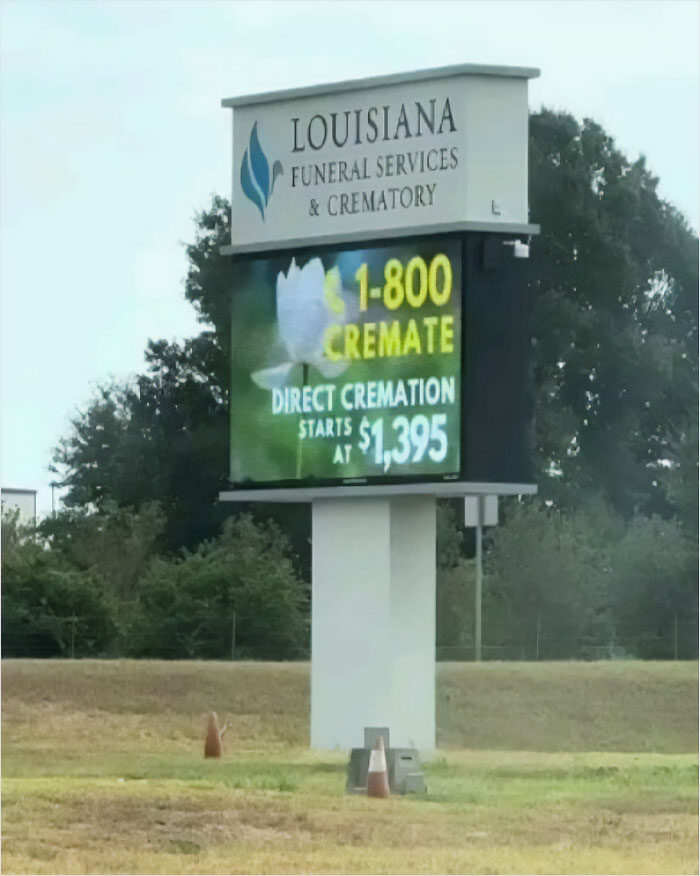 Louisiana Funeral Services sign advertising cremation prices, showcasing humans-of-capitalism-pictures theme.