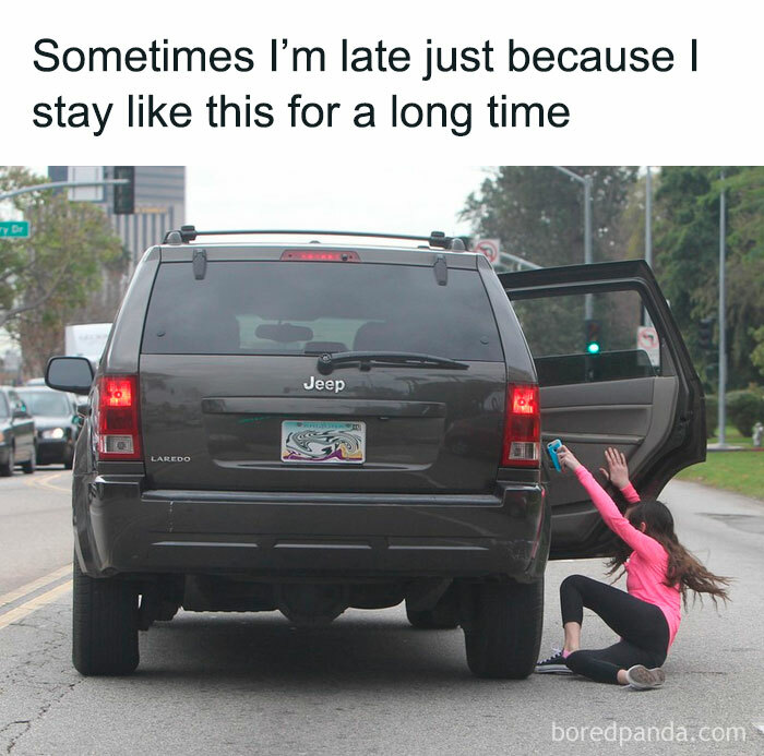 Person in pink stretching beside open car door, adding humor to the scene.