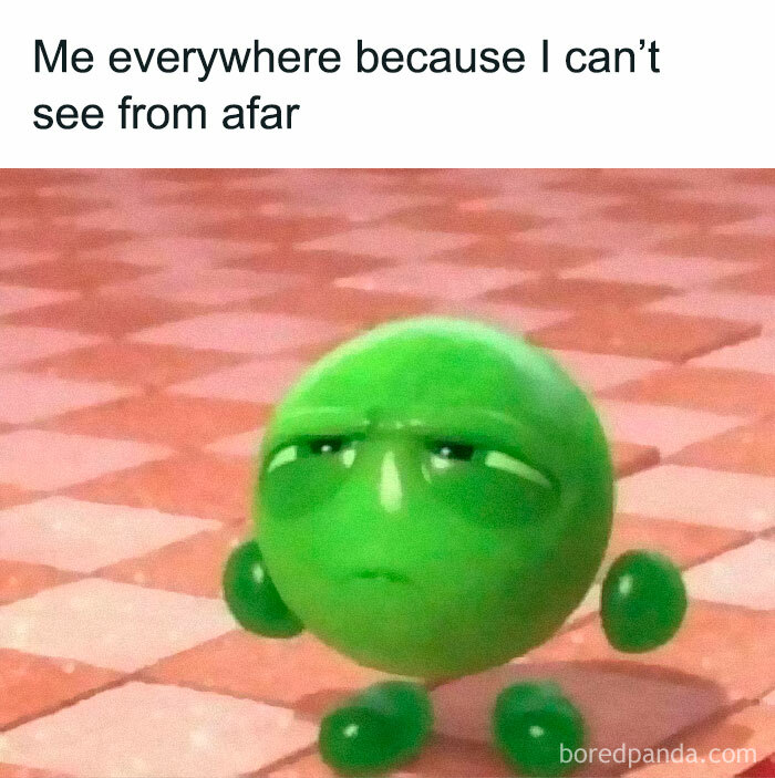 Cartoon green character with squinting eyes on a checkered floor, representing a hilarious meme.