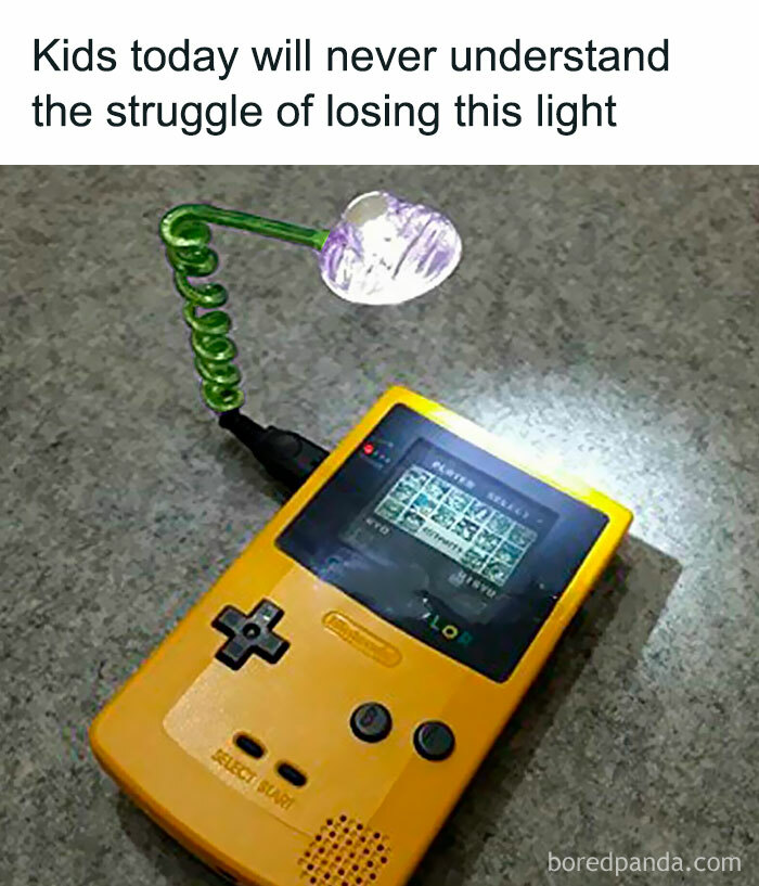 Nostalgic meme of a yellow Game Boy with an attached light on a gray surface.