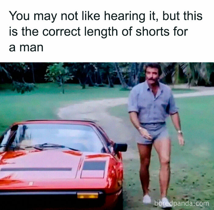 Nostalgic meme of a man in short shorts standing by a red sports car on a grassy path.