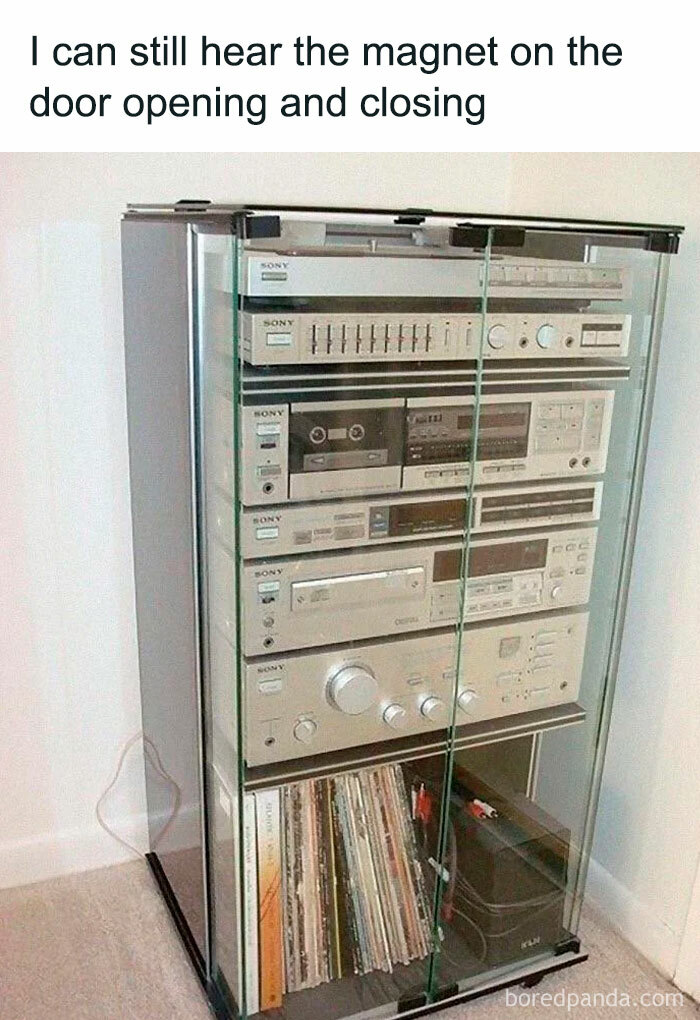 Old stereo system in a glass cabinet, bringing nostalgic memories with vintage audio equipment and records.