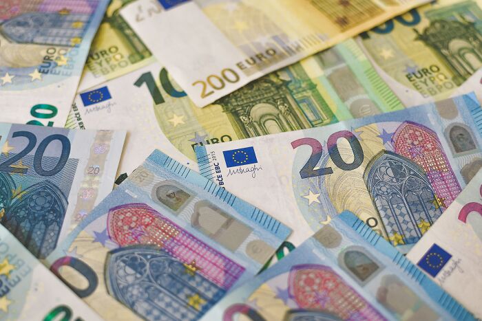 Euro banknotes spread out, symbolizing saving money and financial strategies in 2025.