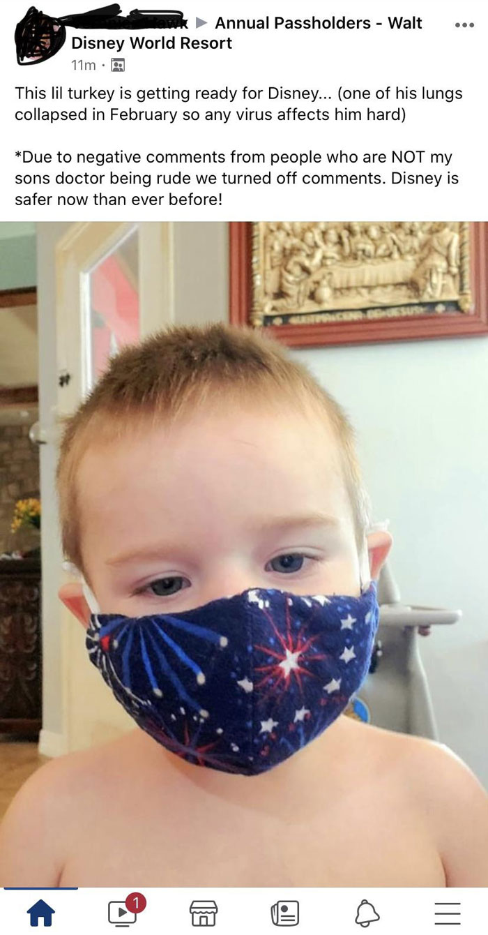 Child wearing a star-patterned mask, ready for Disney.