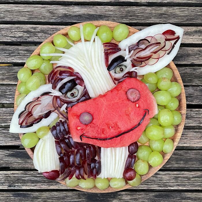 Fruit arranged into a cow face, showcasing healthy eating as art.