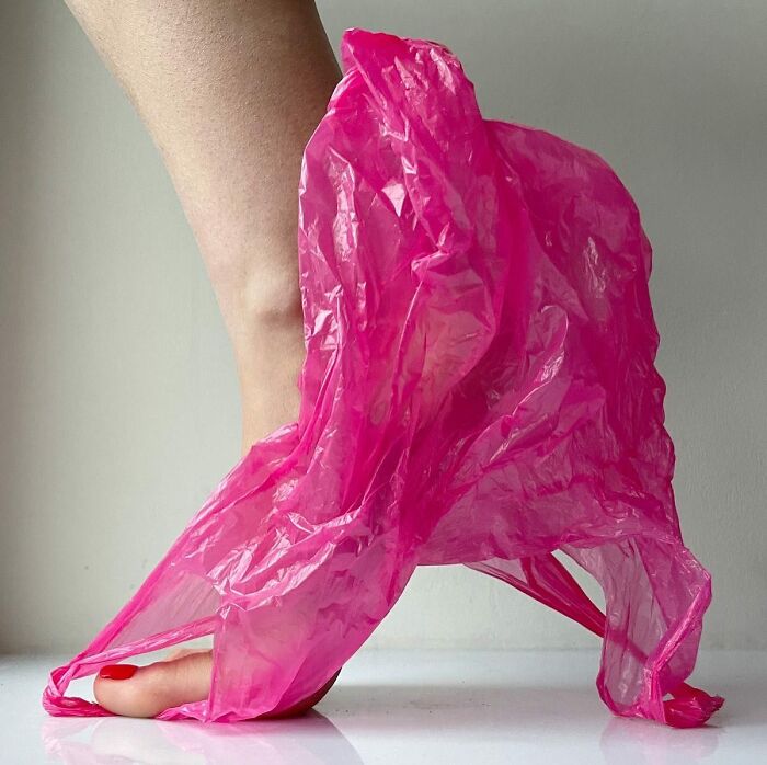 Footwear made from a pink plastic bag, transforming it into sculptural shoe art.