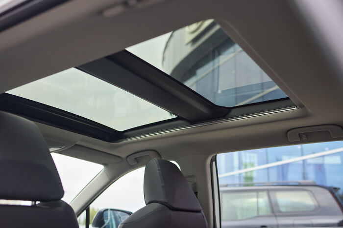 Car interior view from the sunroof, showcasing a modern vehicle design.