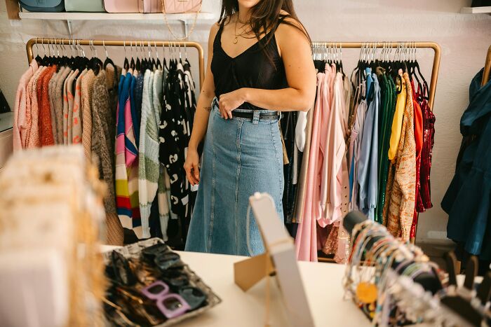 Woman browsing clothes.