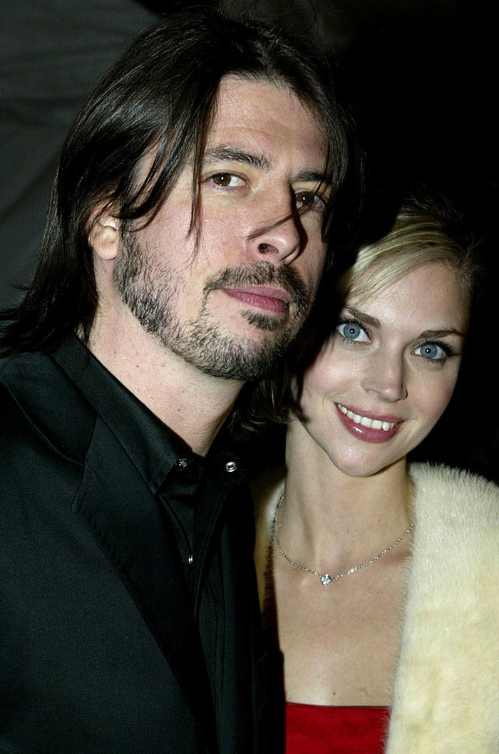 A couple in formal attire, highlighting Jordyn Blum, Dave Grohl’s wife, attending an event.