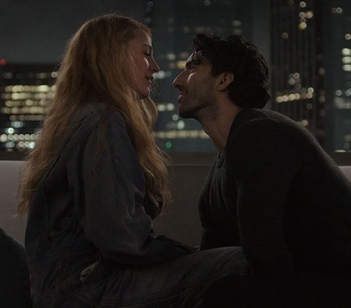 Two actors in an intense scene at night with city lights, related to Justin Baldoni and Blake Lively discussion.