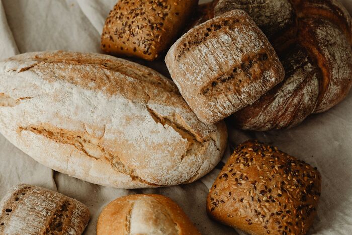 Assorted artisan breads with seeds, showcasing quality and craftsmanship worth spending money on.