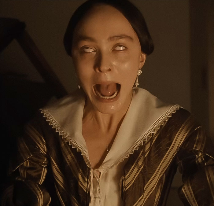 A woman in period clothing acting wide-eyed with mouth open, related to a Nosferatu audition.