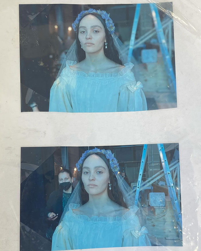 Actress in a vintage gown and floral headpiece during Nosferatu audition.