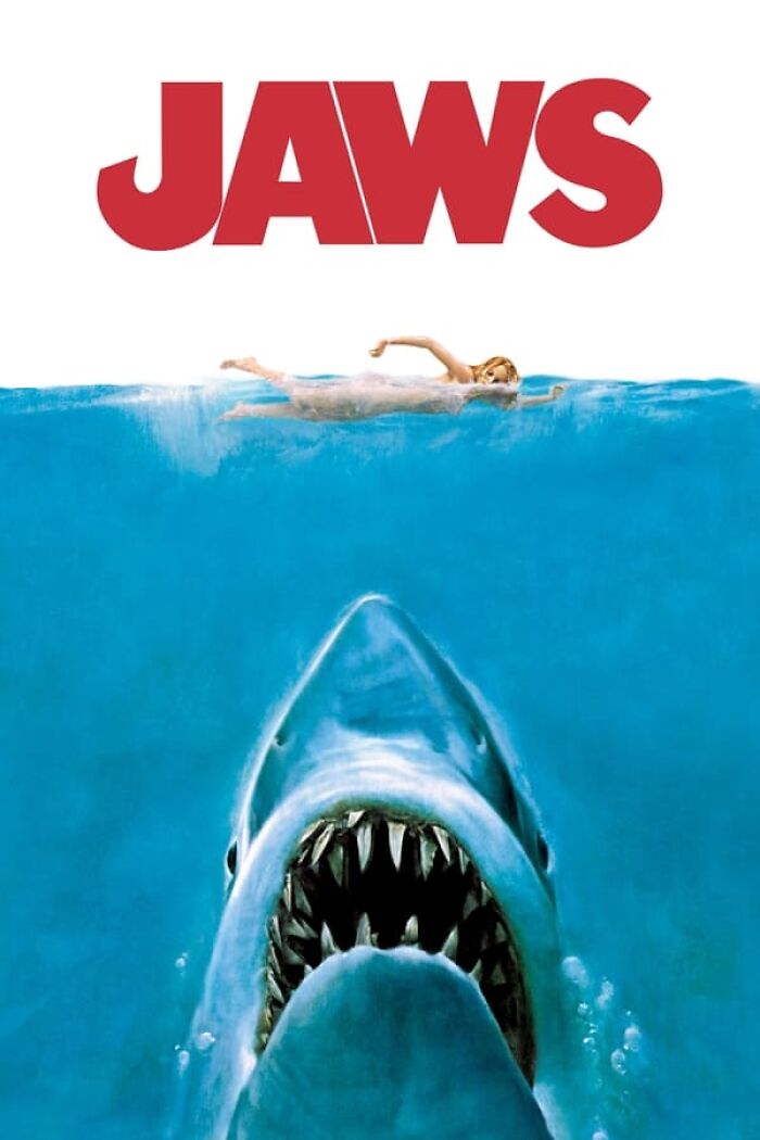 Jaws movie poster featuring a swimmer and a shark, representing best nostalgia movies.