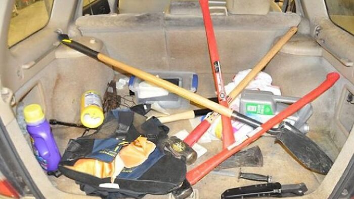 Car trunk filled with various tools and items, related to true crime cases plot twists.