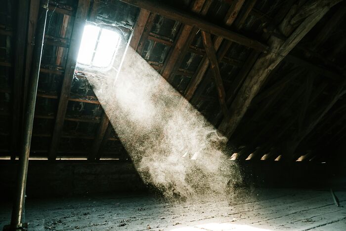 Sunlight streaming through an attic window.