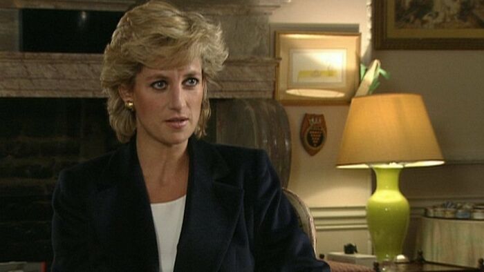 A woman with short blonde hair in a room with a lamp and fireplace, related to impactful celebrity deaths.