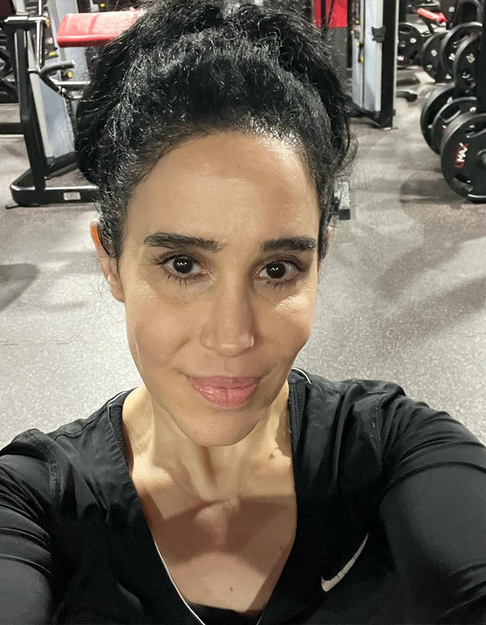 Nadya Suleman, also known as Octomom, takes a selfie at a gym wearing a black top.