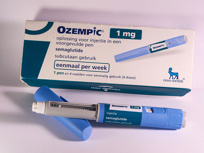 Ozempic injection pen and box displayed, highlighting Ozempic\'s side effects.