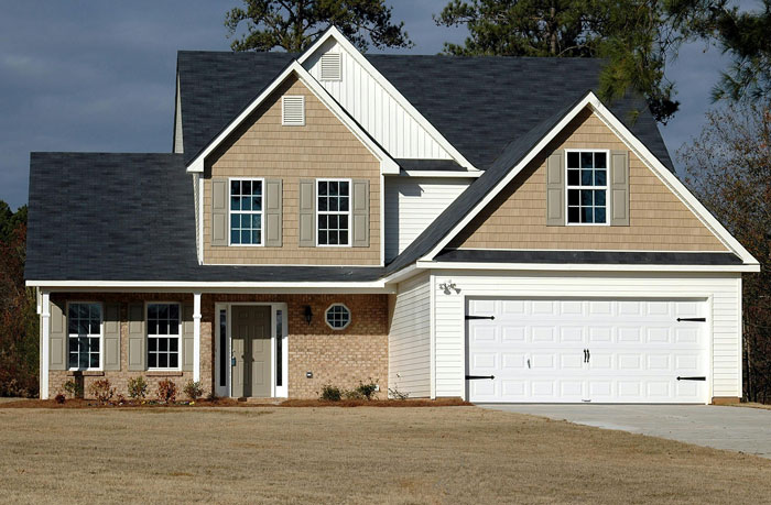 Suburban house representing a shared family home with mortgage responsibilities.