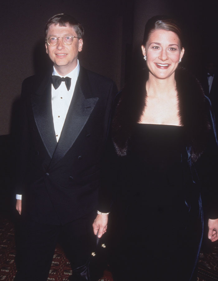 A couple in formal attire at an event.