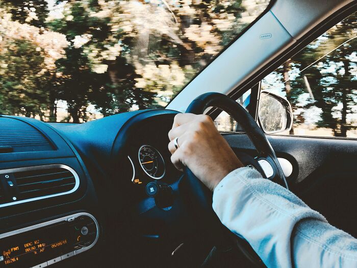 A person driving a car, highlighting how driving has lost its appeal for older adults.