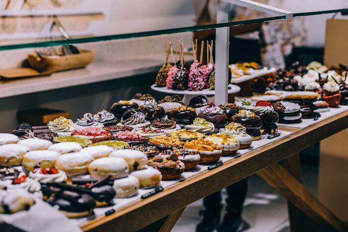 Assorted pastries and sweets on display, highlighting indulgences that might lose appeal for older adults.