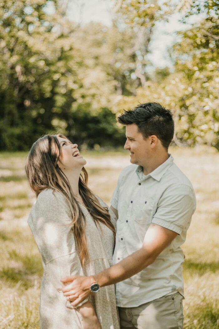 Man and woman smiling at each other outdoors, highlighting non-sexual attraction.