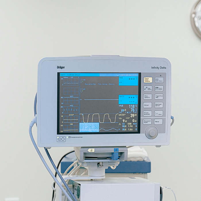 NICU monitor in hospital showing vital signs and readings.