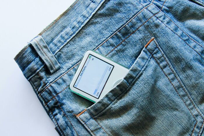 MP3 player in denim jeans pocket.