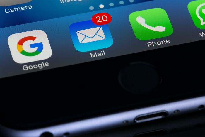 Email app on a smartphone screen showing 20 unread messages, related to unethical life hack tactics.