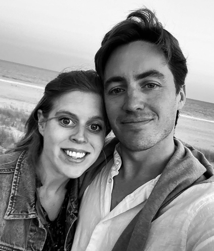 Princess Beatrice and Edoardo Mapelli Mozzi smiling for a selfie outdoors.