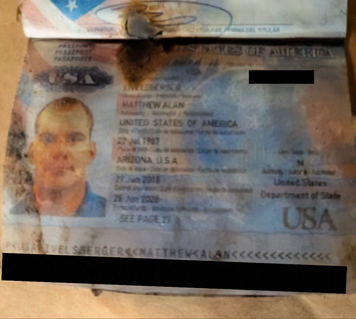 Damaged U.S. passport allegedly linked to mystery Cybertruck explosion, highlighting patriotic American claims.