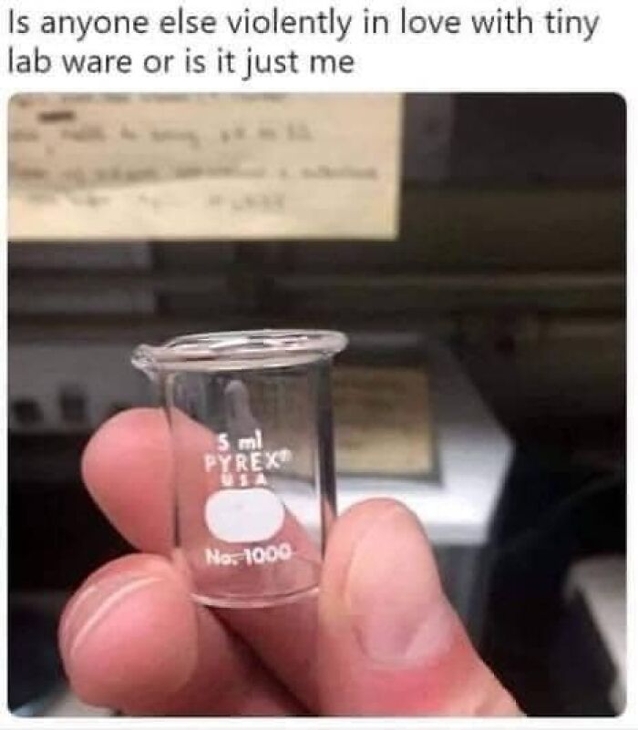 Hand holding a tiny 5 ml Pyrex beaker, featuring a humorous science meme text above.