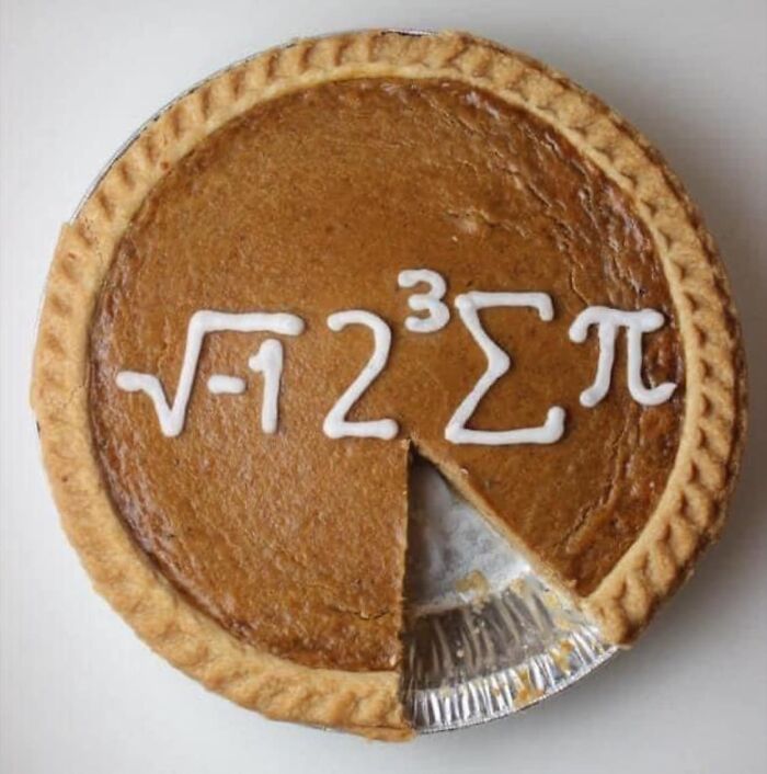 Pumpkin pie with math symbols in icing, showcasing a science meme.