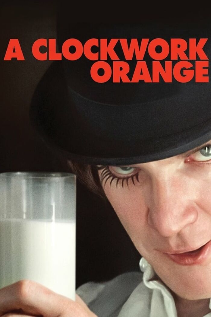 Character from A Clockwork Orange holding a glass of milk, representing nostalgia movies.