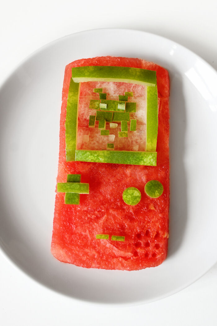 Watermelon art shaped like a game console with fresh green ingredients for buttons and screen.