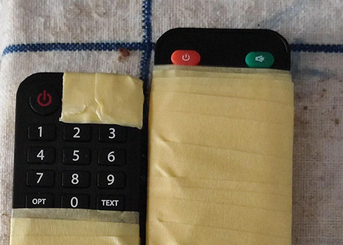 Older people creatively adapt remote controls with tape, demonstrating learning and sharing adorable tech tips with grandparents.