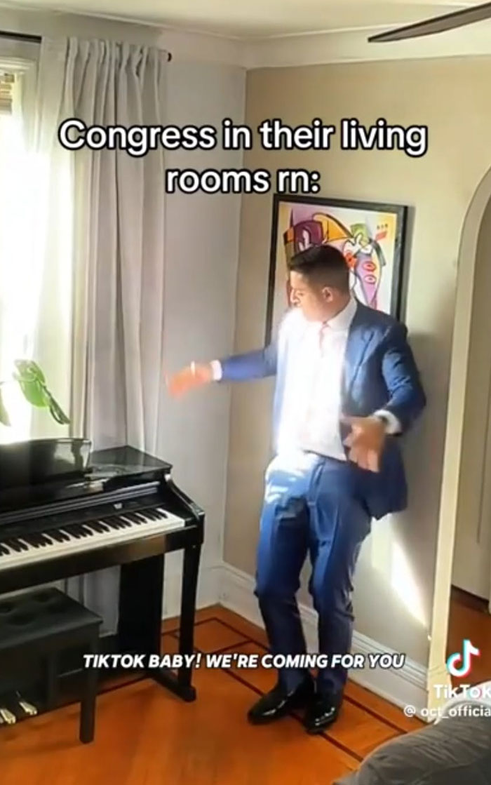 Person in a suit dancing humorously near piano, reacting to TikTok ban news.