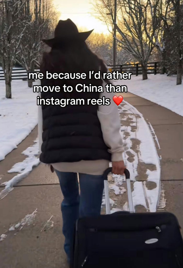 Person with suitcase reacts to TikTok ban in America, prefers China over Instagram Reels.