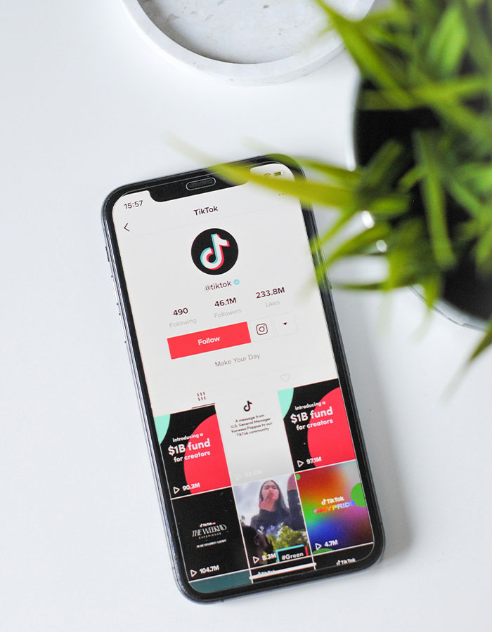 Smartphone displaying TikTok app interface, amid discussions on possible ban.