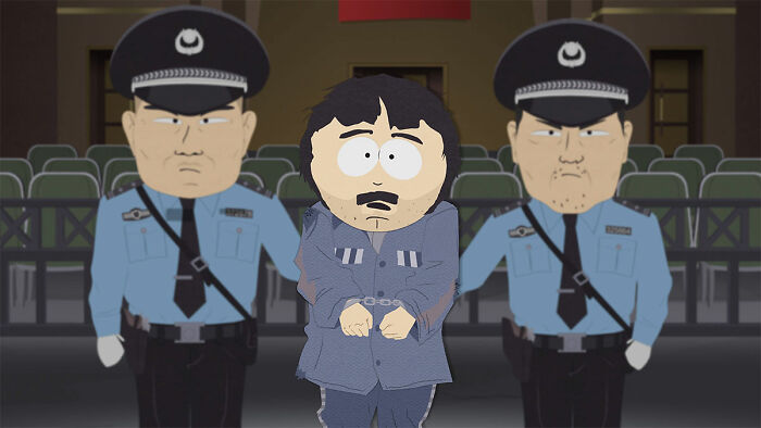 Cartoon character handcuffed, flanked by two police officers, in a courtroom setting.