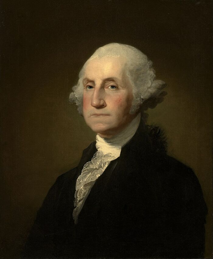 Portrait of a historical figure with white hair and formal attire, associated with new facts and learning.