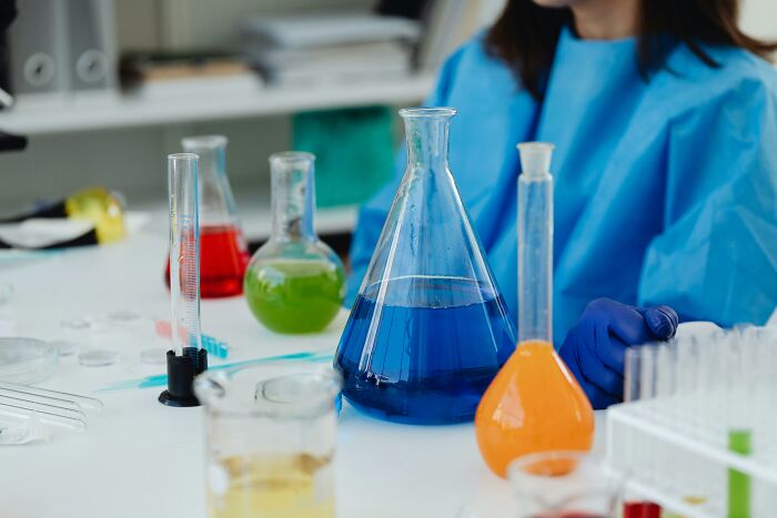 Laboratory setup with colorful chemical liquids representing toxic things in the body.